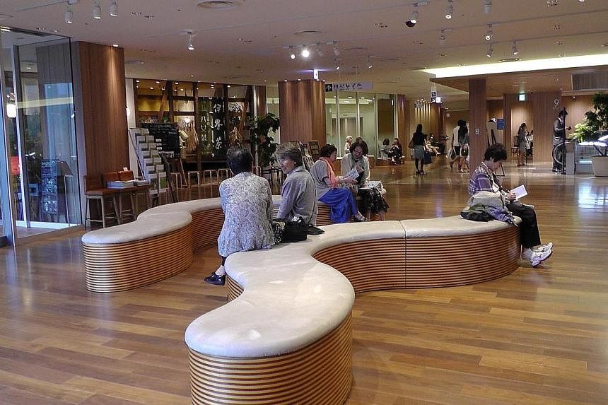 Shoppers taking a break on the ninth floor of the swanky Mitsukoshi department store in the shopping district of Ginza in Tokyo. Japan’s department stores have been adapting to a rapidly graying population by providing more rest areas.&nbsp;-- ST P