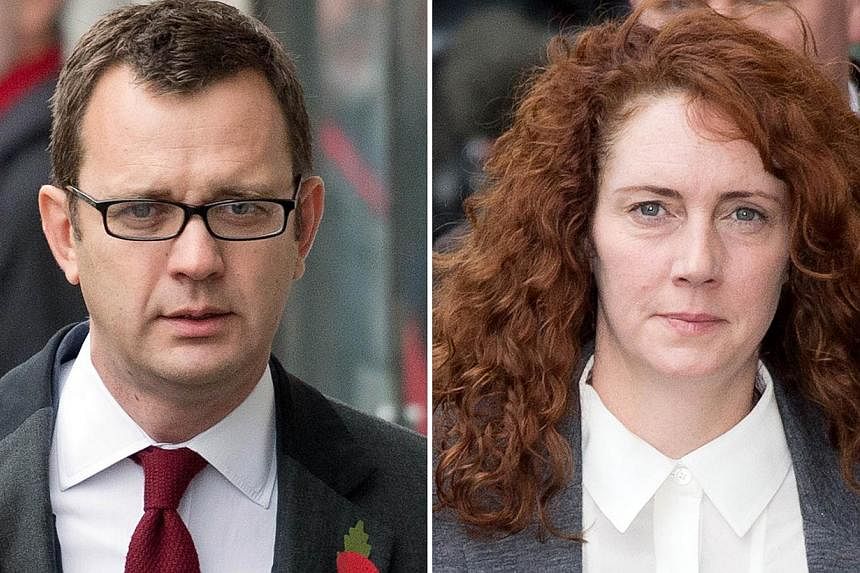 This file combination of pictures created on Oct 31, 2013 shows Former News of the World editor and Downing Street communications chief Andy Coulson (left) and Rebekah Brooks, former News International chief executive. -- PHOTO: AFP