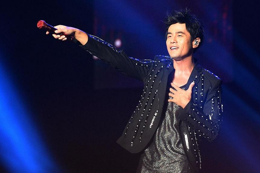 Taiwanese singer Jay Chou performs at the SingTel Singapore Grand Prix Formula One Concert 2012 on Sept 21, 2012. Jay Chou announced that he would be "a man of his word" and marry model Hannah Quinlivan before January next year. -- PHOTO: MYPAPER