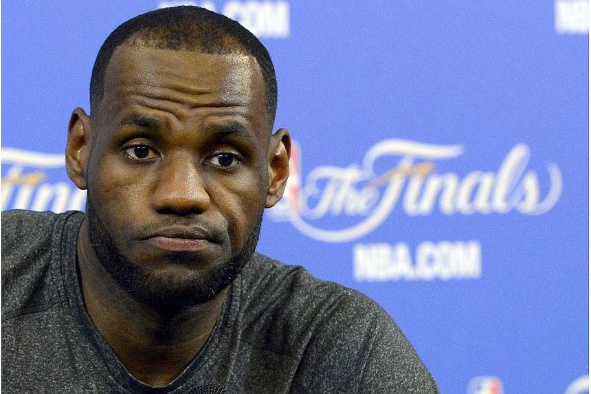 This June 11, 2014 file photo shows Miami Heat LeBron James during a press conference ahead of game 4 of the 2014 NBA Finals against the San Antonio Spurs in Miami, Florida. -- PHOTO: AFP