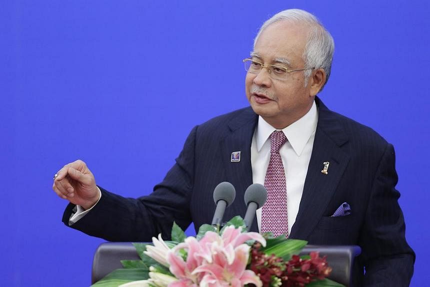 Malaysian Prime Minister Najib Razak has called a press conference on Wednesday and speculation is rife that it is related to a reshuffle of the Cabinet. -- PHOTO: REUTERS