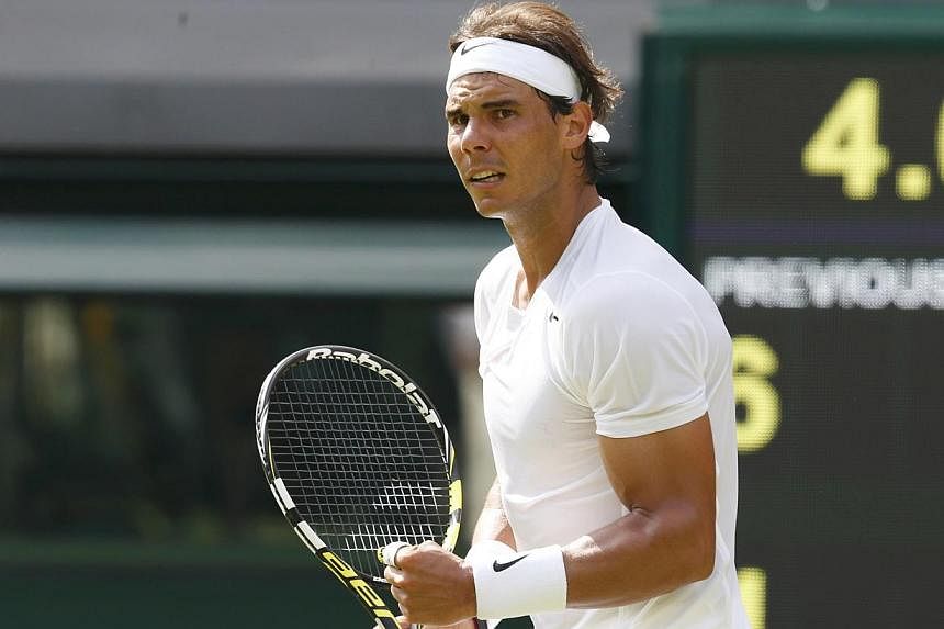 Rafael Nadal of Spain reacts to winning the second set in his men's singles tennis match against Martin Klizan of Slovakia at the Wimbledon Tennis Championships, in London on June 24, 2014. -- PHOTO: REUTERS