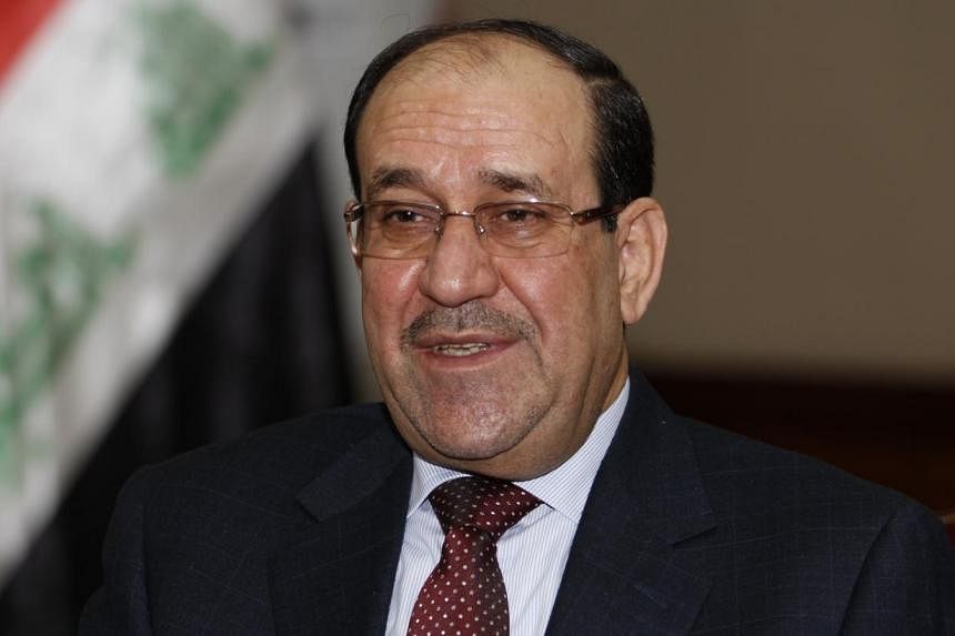 Iraq's Prime Minister Nouri al-Maliki speaks during an interview with Reuters in Baghdad in this Jan 12, 2014, file photo.&nbsp;Mr Maliki said on Wednesday he is committed to forming a new government on time as he fights growing calls from his oppone