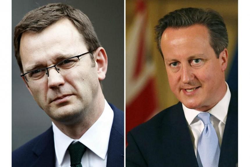 British Prime Minister David Cameron (right) on Wednesday apologised to parliament for hiring Andy Coulson, his ex-media chief, after Coulson was found guilty of being part of a phone-hacking conspiracy. -- PHOTO: REUTERS/AFP