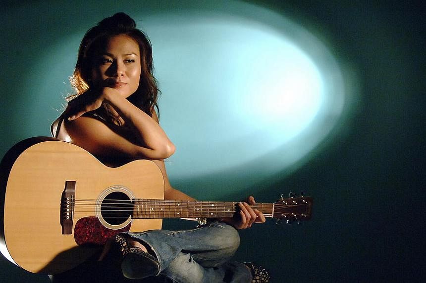 Local singer-songwriter Tanya Chua will have to wait a little longer to stand on the vaunted stage of Hong Kong Coliseum. Her Thursday concert there has been cancelled as her bout of flu has worsened into acute laryngitis. -- ST PHOTO: DESMOND FOO