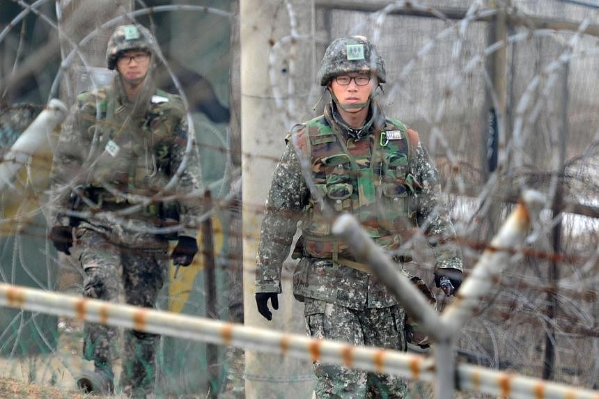 In a file photo taken on December 21, 2011 South Korean soldiers patrol at the Demilitarized Zone in Paju.&nbsp;The South Korean military refused on Thursday to release the suicide note of a soldier who killed five comrades, as speculation mounted th