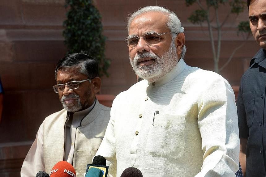 Indian Prime Minister Narendra Modi addresses the media on his arrival for the first session of India's newly elected Parliament in New Delhi on June 4, 2014. The Indian PM&nbsp;faces accusations his government ran a campaign to block the appointment