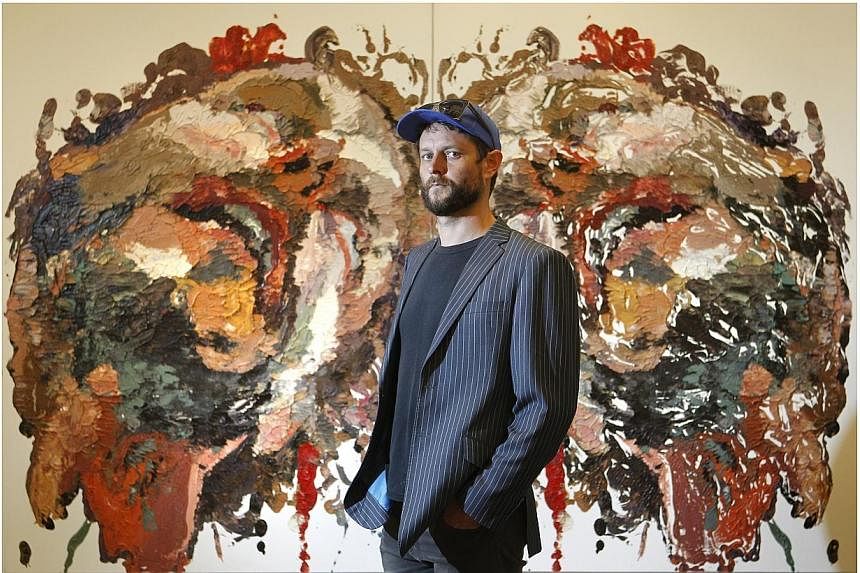 Australian artist Ben Quilty with his painting "Smashed Rorschach" at the exhibition preview of the inaugural Prudential Eye Awards for Contemporary Asian Art in Suntec City Mall on Jan 17, 2014.&nbsp;An exhibition on contemporary Singapore art will 
