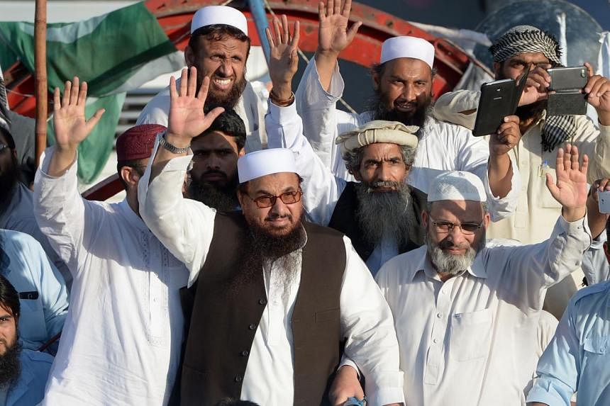 Jamat-ud-Dawa leader&nbsp;Hafiz Saeed (centre) waving alongside others at a rally in Islamabad last month. In 2012, the United States offered a US$10 million reward for information leading to the arrest of Saeed, the founder of Lashkar-e-Taiba, a Pak