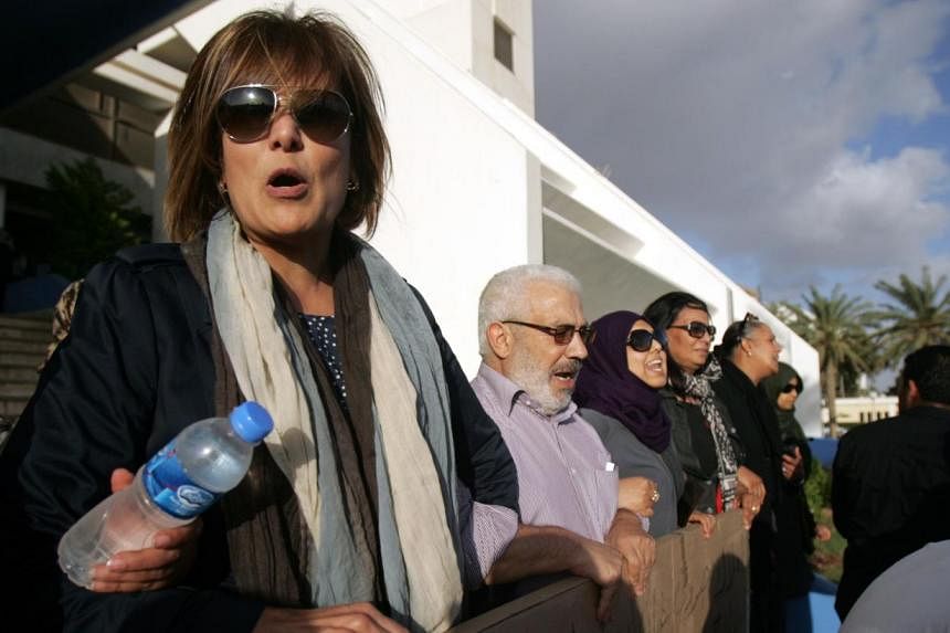 A picture taken in May shows Libyan human rights activist Salwa Bugaighis (left), who was shot dead by unknown assailants at her home in the restive east Libyan city of Benghazi late on Wednesday. She was shot several times and was taken to hospital 