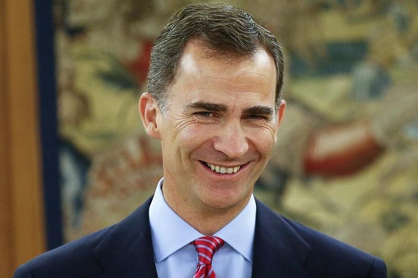 Spain's King Felipe smiles as he poses before his meeting with Parliament Chairman Jesus Posada at Zarzuela Palace in Madrid, June 23, 2014. -- PHOTO: REUTERS