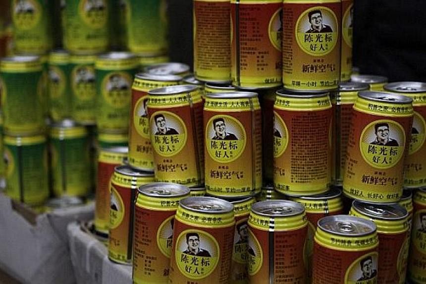Canned air produced by Chen Guangbiao's company. -- PHOTO: REUTERS