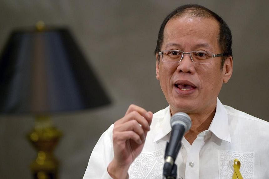 Philippine President Benigno Aquino gestures as he speaks to reporters on the sidelines of an Asia-Europe meeting in Manila on June 5, 2014.&nbsp;Philippine President Benigno Aquino assured the country's largest Muslim rebel group on Friday, June 27,