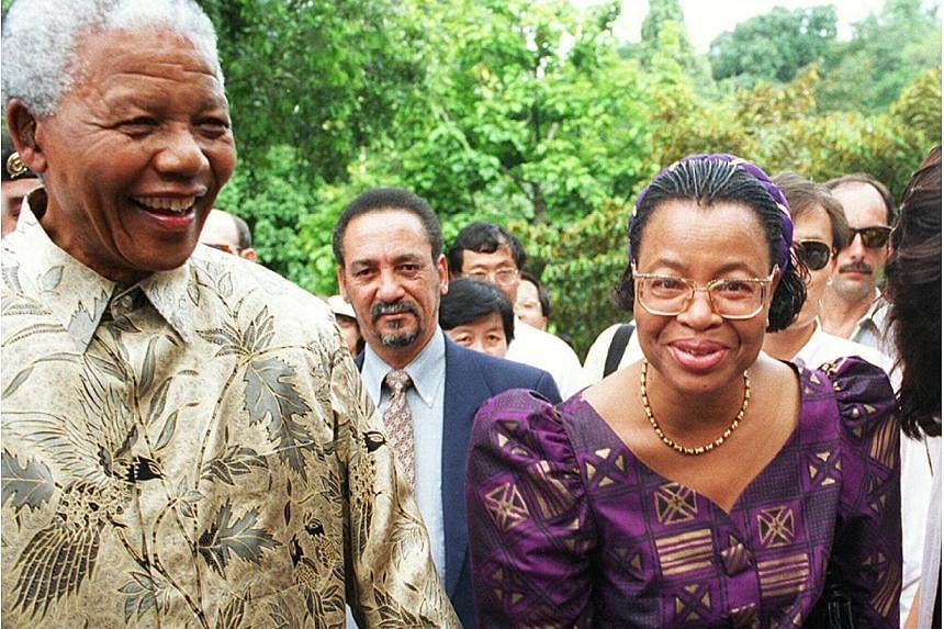 Nelson Mandela's widow, Graca Machel, (right), announced she will resume her public life after completing a six-month mourning period for her "best friend". -- PHOTO: ST FILE