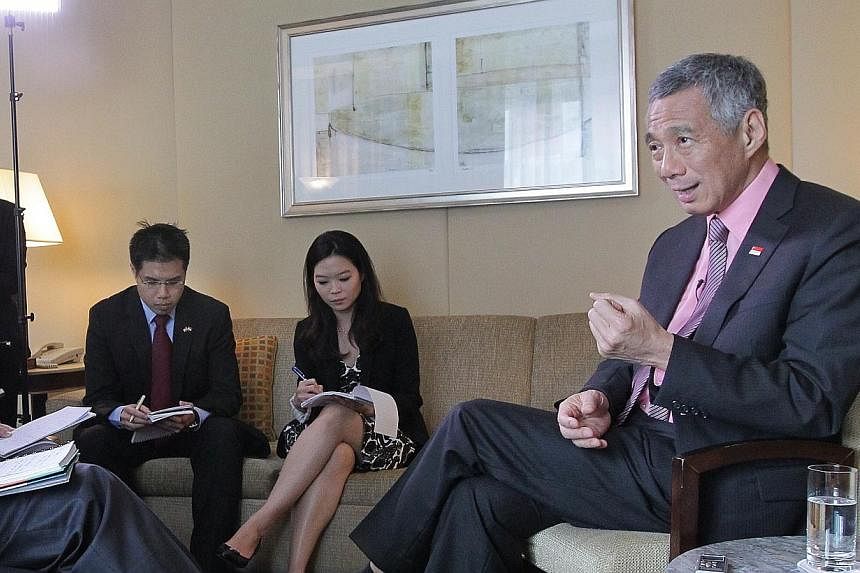Prime Minister Lee Hsien Loong attends a local media round-up interview at the Four Seasons Hotel, in New York City, on June 26, 2014. -- ST PHOTO: NEO XIAOBIN