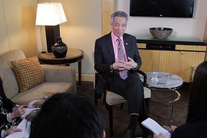 Prime Minister Lee Hsien Loong attends a local media round-up interview at the Four Seasons Hotel, in New York City, on June 26, 2014. -- ST PHOTO: NEO XIAOBIN