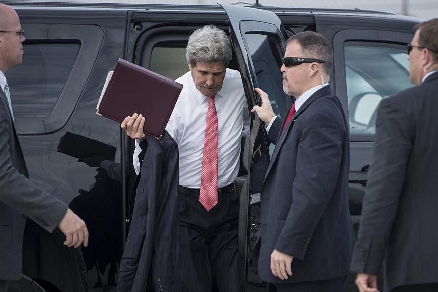 US Secretary of State John Kerry arrives to board his plane at Le Bourget Airport, north of Paris, on June 27, 2014.&nbsp;US Secretary of State John Kerry arrived in Saudi Arabia on Friday to meet the Syrian opposition as Washington unveiled plans to