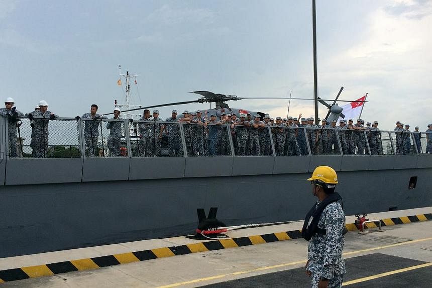 About 500 family members and friends thronged Changi Naval Base on Friday morning to welcome home their loved ones aboard the RSS Tenacious, who were away at sea for three months on anti-piracy patrols. --&nbsp;ST PHOTO: LEE JIAN XUAN