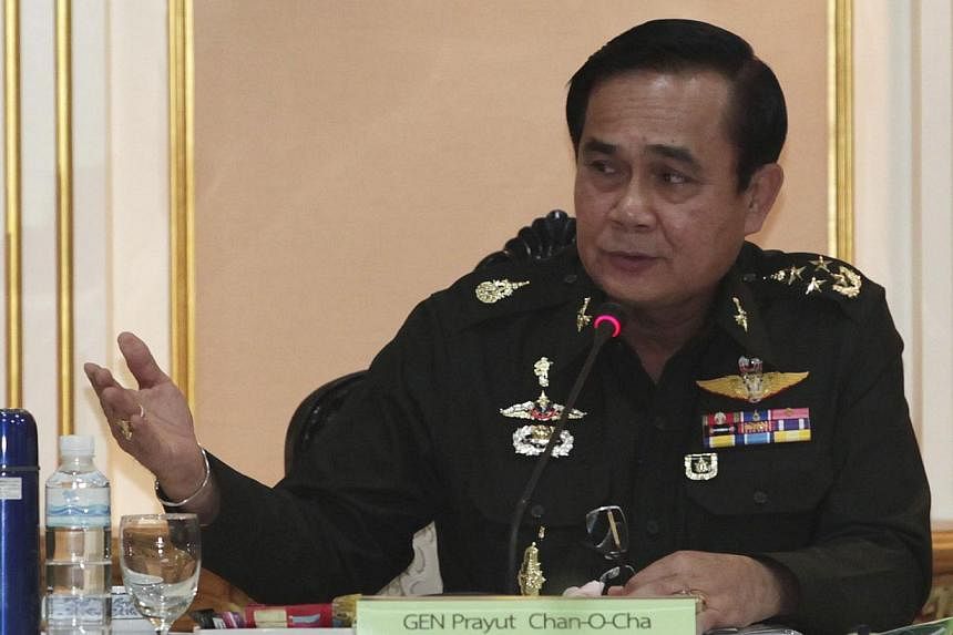 Thai Army chief General Prayuth Chan-ocha speaks during a meeting with members of the International Chamber of Commerce at the Royal Thai Army Headquarters in Bangkok on June 19, 2014. -- PHOTO: REUTERS