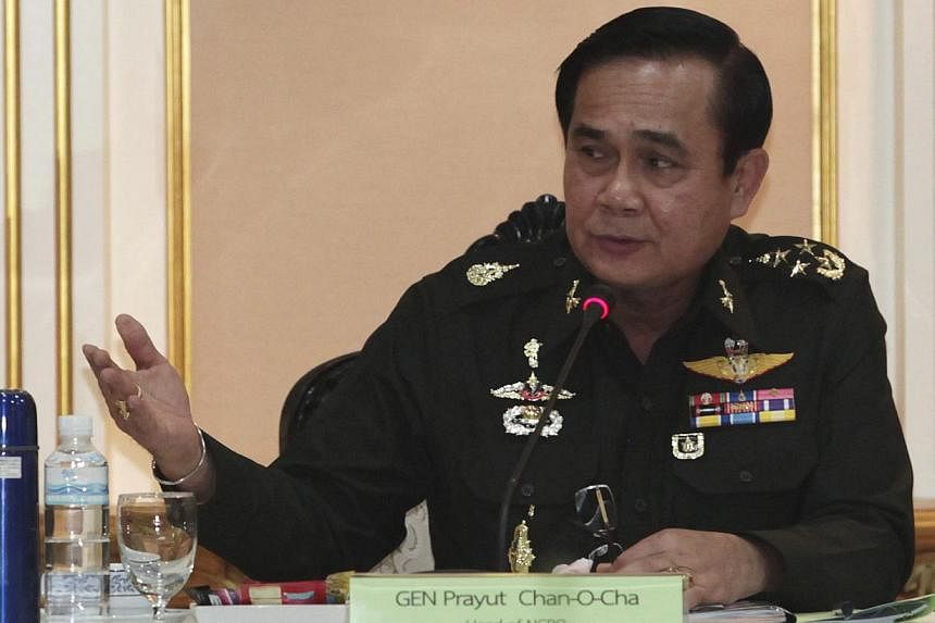 Thai Army chief General Prayuth Chan-ocha speaks during a meeting with members of the International Chamber of Commerce at the Royal Thai Army Headquarters in Bangkok June 19, 2014. -- PHOTO: REUTERS