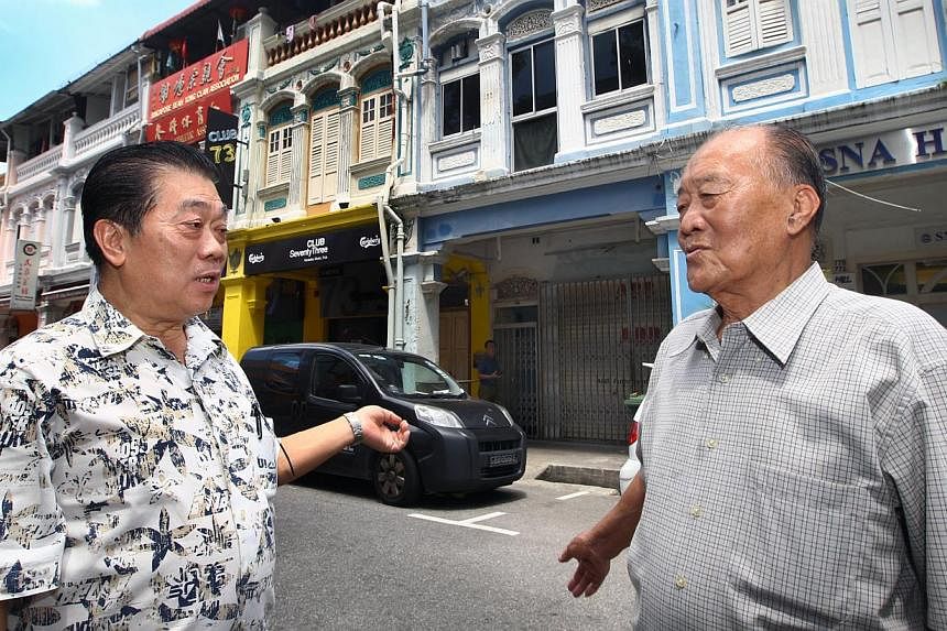 Mr Ding Chin Hock (left) and Mr Tan Ah Mok, 84, in front of their former Maude Road homes. One of the shophouses, No. 81, was a boarding house for Mr Koh Teong Koo and other Hock Chia rickshaw pullers.