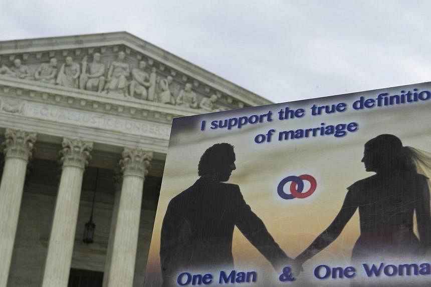 A sign supporting traditional marriage is seen during the second annual 'March for Marriage' on June 19, 2014 at the US Supreme Court in Washington, DC. The US Supreme Court will rule on Monday on whether an employer can cite religious beliefs as a r