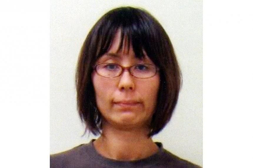 This handout file picture, released by Tokyo's Metropolitan Police department on June 4, 2012 shows Naoko Kikuchi, a former member of the doomsday cult Aum Supreme Truth in Tokyo.&nbsp;A former member of the Aum Supreme Truth cult, who spent 17 years