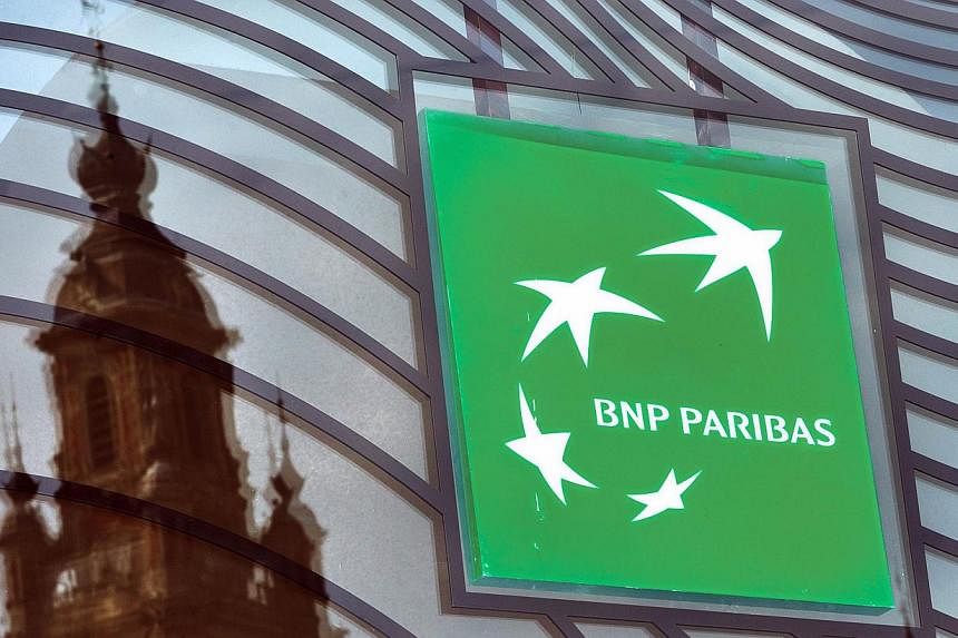 A photo taken on June 24, 2014 in Lille, northern France shows the logo of the French bank BNP Paribas.&nbsp;French bank BNP Paribas has agreed to pay US authorities a US$8.9 billion (S$11.1 billion) fine to avoid being tried in court for dealing wit