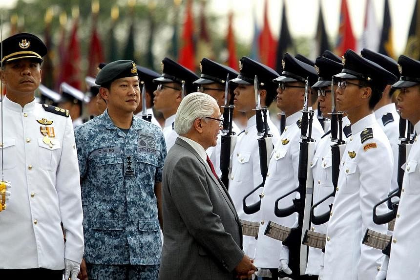 President Tony Tan Keng Yam, inspection of guard-of-honour in the the Singapore Armed Forces (SAF) commemorate SAF Day 2014 on 1 Jul 2014 (Tue). -- ST PHOTO: CHEW SENG KIM