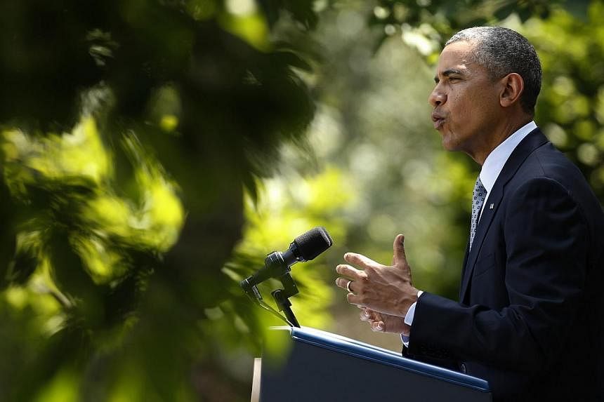 US President Barack Obama speaks about immigration reform from the Rose Garden of the White House in Washington on June 30, 2014.&nbsp;President Barack Obama ignited a new power showdown with Republicans on Monday, vowing to fix America’s broken im