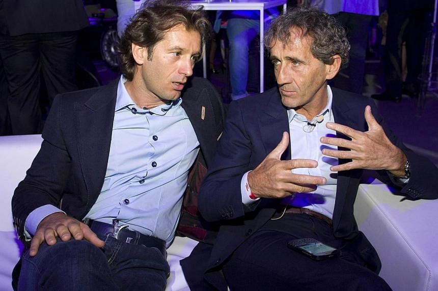 Italian former Formula One racing driver Jarno Trulli (left) speaks with French former Formula One racing driver Alain Prost (right) at the Global Launch of the all-electric FIA Formula E Championship in London on June 30, 2014.&nbsp;Grand Prix great