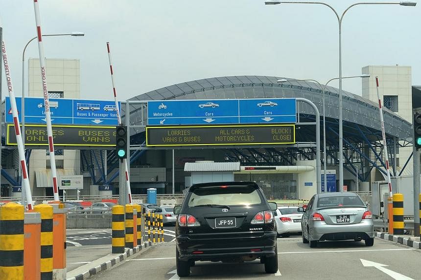 The Singapore Immigrations and Customs checkpoint at Tuas Second Link, as seen from Johor, Malaysia.&nbsp;Foreigners driving into Singapore will have to pay more from August, the Land Transport Authority announced on Tuesday. -- PHOTO: ST FILE