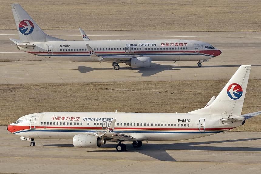 China Eastern Airlines Boeing 737-800 planes are seen at an airport in Taiyuan, Shanxi province, April 6, 2014.&nbsp;China Eastern Airlines said Wednesday it would transform one of its units into a budget airline, the first Chinese state carrier to d