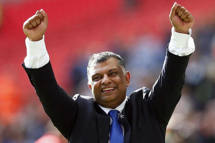 Queens Park Rangers' owner Tony Fernandes celebrates after their Championship play-off final soccer match against Derby County at Wembley Stadium in London on May 24, 2014. Fernandes has sold the British-based Caterham Formula One team to a consortiu