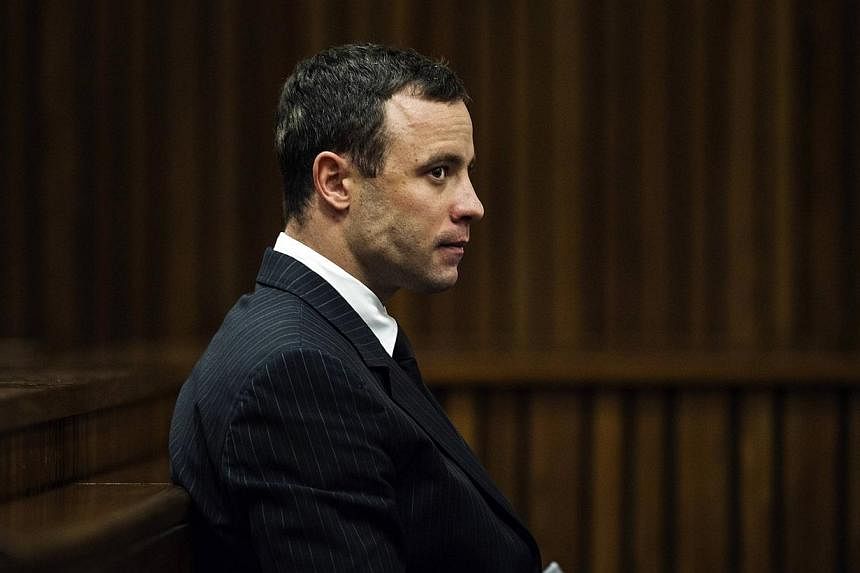 Paralympian star Oscar Pistorius, on trial over the killing of his girlfriend, is suffering from post-traumatic stress and is a suicide risk, a South African court heard on Wednesday. -- PHOTO: REUTERS