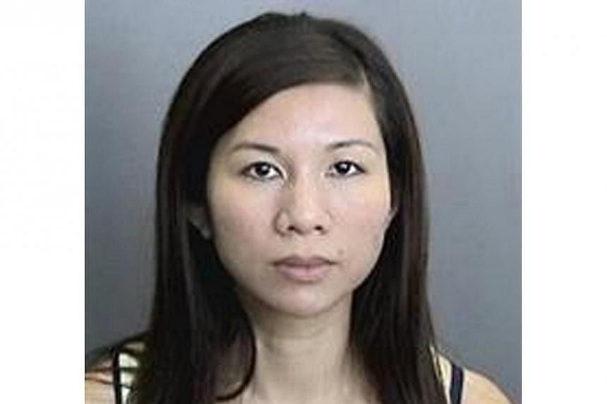 Tracy Le, is pictured in this undated police handout photo courtesy of the Anaheim Police Department. A Southern California couple have been arrested for child endangerment over accusations they kept their 11-year-old severely autistic son in a metal
