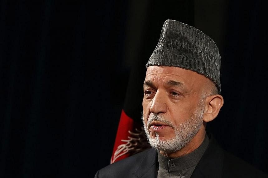 Afghanistan's President Hamid Karzai speaks during a cultural event in Kabul on May 15, 2014. -- PHOTO: REUTERS