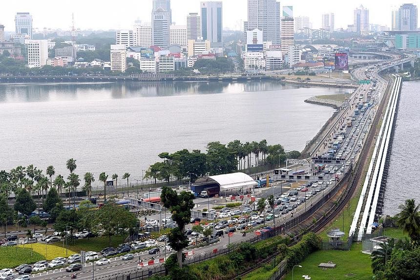 Malaysia will study a proposal by the Johor state government to impose a charge on foreign cars entering the Malaysian border via Johor Baru, said Transport Minister Datuk Seri Liow Tiong Lai. -- ST PHOTO:&nbsp;LIM SIN THAI