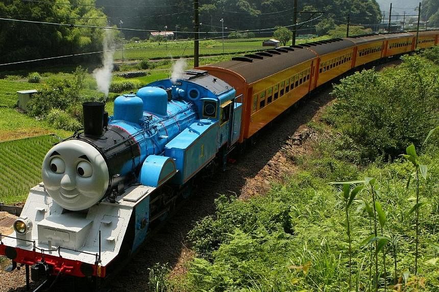 A life-sized Thomas the Tank Engine making a test run in the mountains on a line run by Japan's Oigawa railway near the city of Shimada in Shizuoka prefecture, west of Tokyo on July 2, 2014. -- PHOTO: AFP