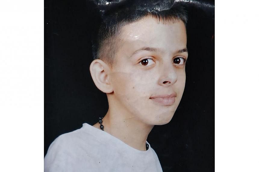 An undated family handout picture obtained on July 2, 2014 shows 16 year old Mohammed Abu Khder, a Palestinian teenager whose body was found today in Jerusalem's forest area. The Palestinian teenager was reportedly kidnapped and killed today, trigger