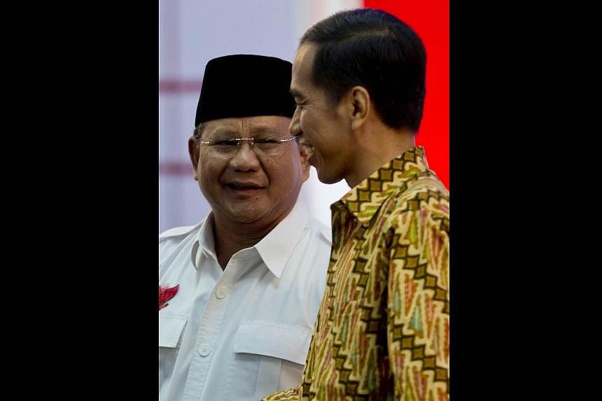 Presidential rivals Mr Prabowo Subianto (left) and Mr Joko Widodo. Although both would seek to strengthen Asean, Mr Subianto, a former general, is likely to take a harder line on foreign policy.