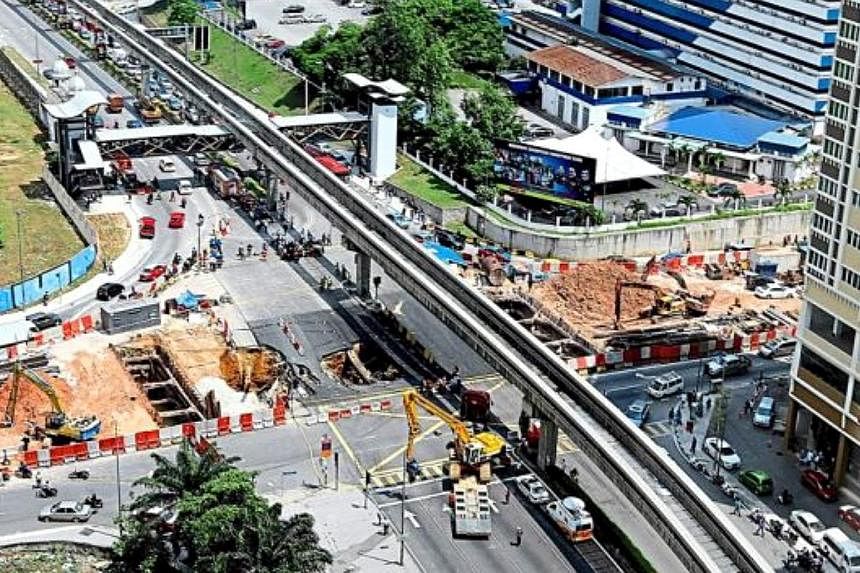 Chaos in the heart of the city: Traffic seen clogged up from Jalan Hang Tuah to Jalan Imbi after two huge sinkholes appeared in the busy area of Kuala Lumpur on Wednesday morning. - THE STAR/ASIA NEWS NETWORK