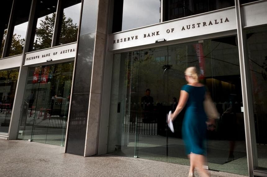 A woman walking past the Reserve Bank of Australia (RBA).&nbsp;Australia's top central banker said on Thursday there were signs business investment was picking up and he saw room for the economy to grow faster in the next few years, although he cauti