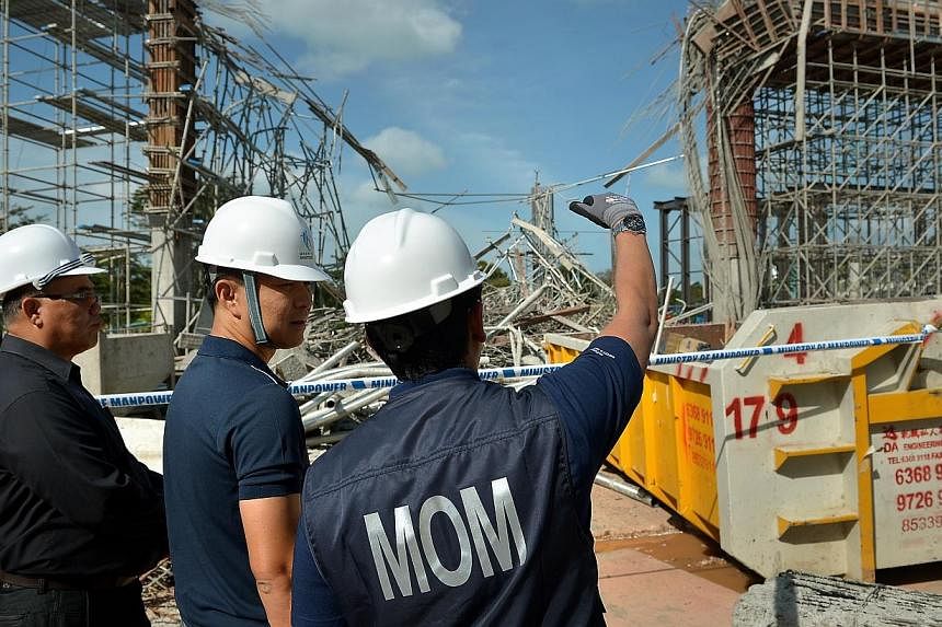 Acting Minister for Manpower Tan Chuan-Jin (centre) visiting the Sentosa worksite where a supporting structure collapsed on Jan 29, 2014, leaving one dead and 10 injured. There were 17 fatalities in the construction sector in the first half of this y
