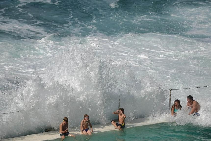 People in an ocean pool at Sydney's famous Bondi Beach. Hundreds of the world's top marine scientists have called for Western Australia to ditch its shark cull policy, arguing there is no evidence that it makes beaches safer. -- PHOTO: AFP