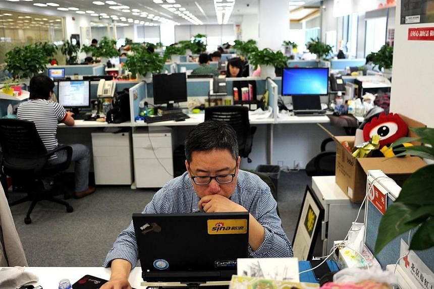 A man using a laptop at an office of Sina Weibo, widely known as China's version of Twitter, in Beijing. A People's Daily article seeks to argue not only that China has the right to set its own rules and regulations for the Internet, but also that an