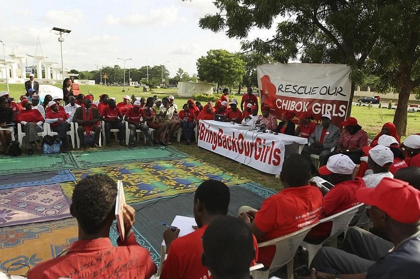 Members of the #BringBackOurGirls Abuja campaign group attend a sit-in protest, a day ahead of the 80th day of the abduction of over 200 schoolgirls, at the Unity fountain in Abuja on July 2, 2014.&nbsp;Villagers from a northeast Nigerian town where 