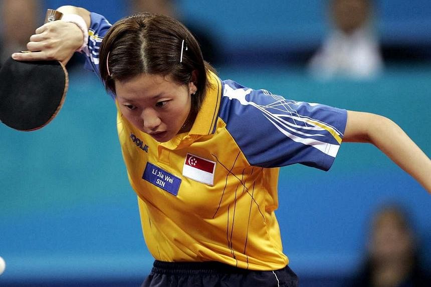 Li Jiawei needs all her cool to overcome North Korean Kim and secure a silver. -- PHOTO: ST FILE
