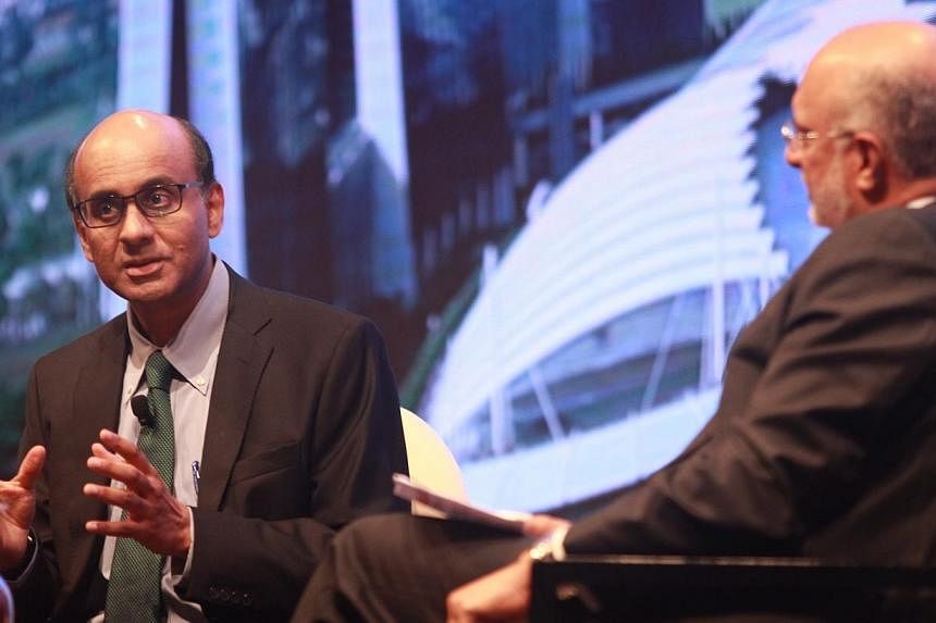 Deputy Prime Minister Tharman Shanmugaratnam (left), who is also Finance Minister, at the annual DBS Asian Insights conference. -- PHOTO: LIANHE ZAOBAO&nbsp;