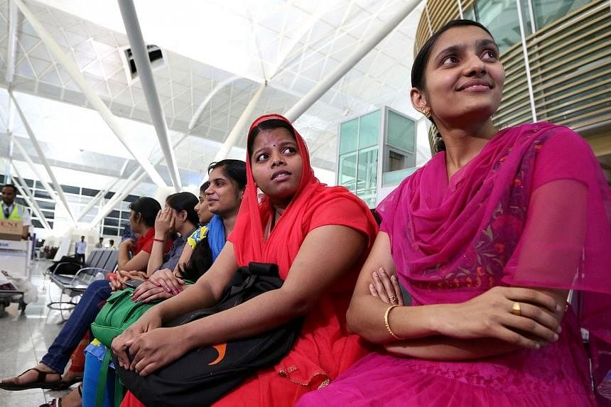 Some of the 46 Indian Nurses, held hostage by Islamic militants in Iraq, wait at the airport before flying home on July 4, 2014, in the city of Arbil in the autonomous Kurdistan region of northern Iraq.&nbsp;A group of 46 Indian nurses who were trapp